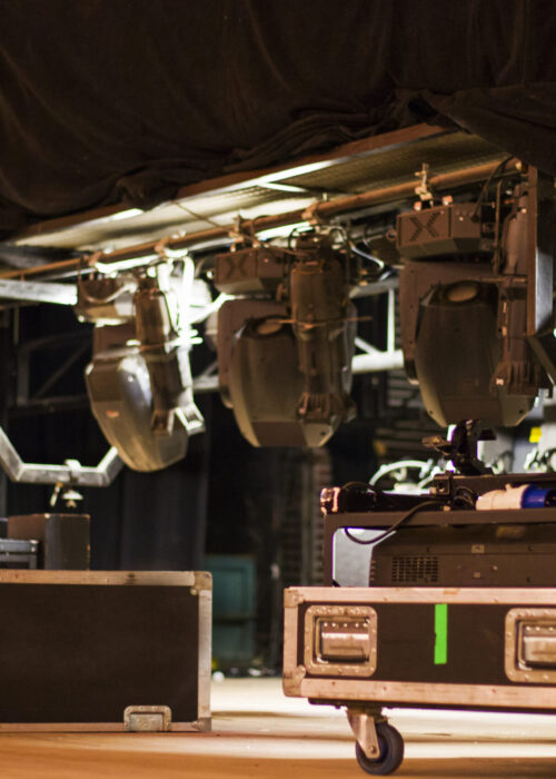 Theater stage and suitcases and box on the wooden floor. Inside the theater. Tbilisi, Georgia.